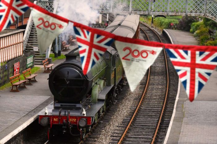 Railway-200-bunting-in-foreground-with-steam-locomotive-behind-1082x720